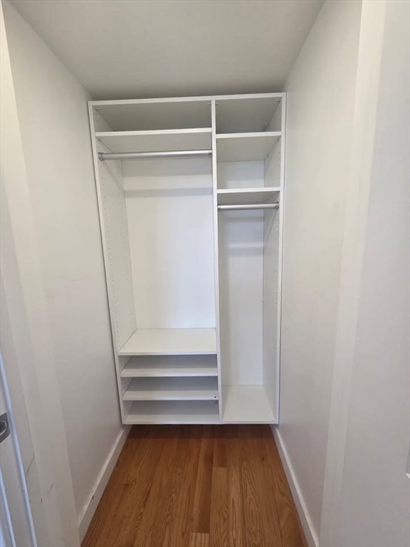 64 Market Street, Unit 303 Lynn, MA 01901 - Photo 6 of 12 a view of walk in closet with wooden floor
