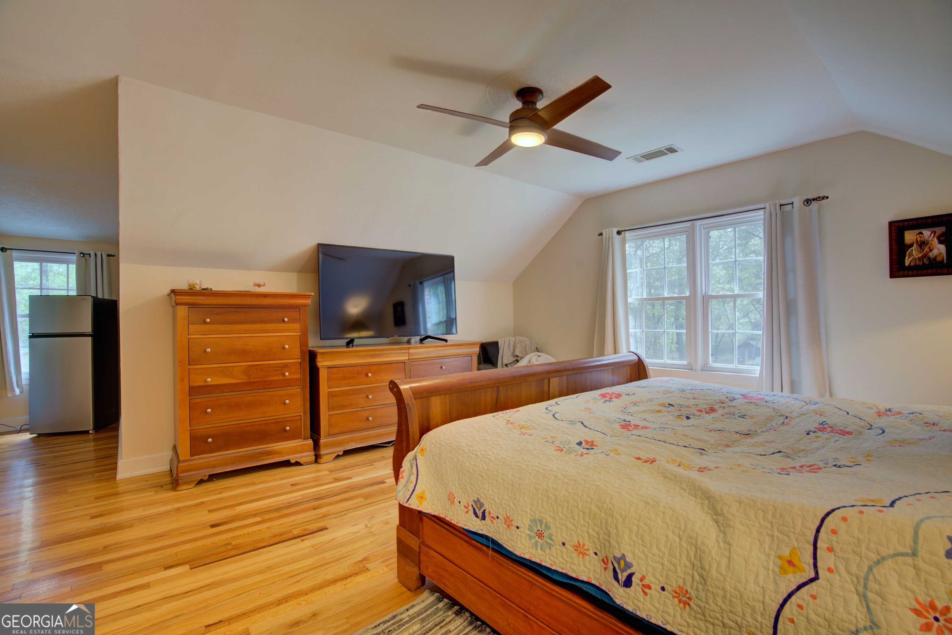 521 West John Hand Road Cedartown, GA 30125 - Photo 32 of 43 a bedroom with a bed and wooden floor