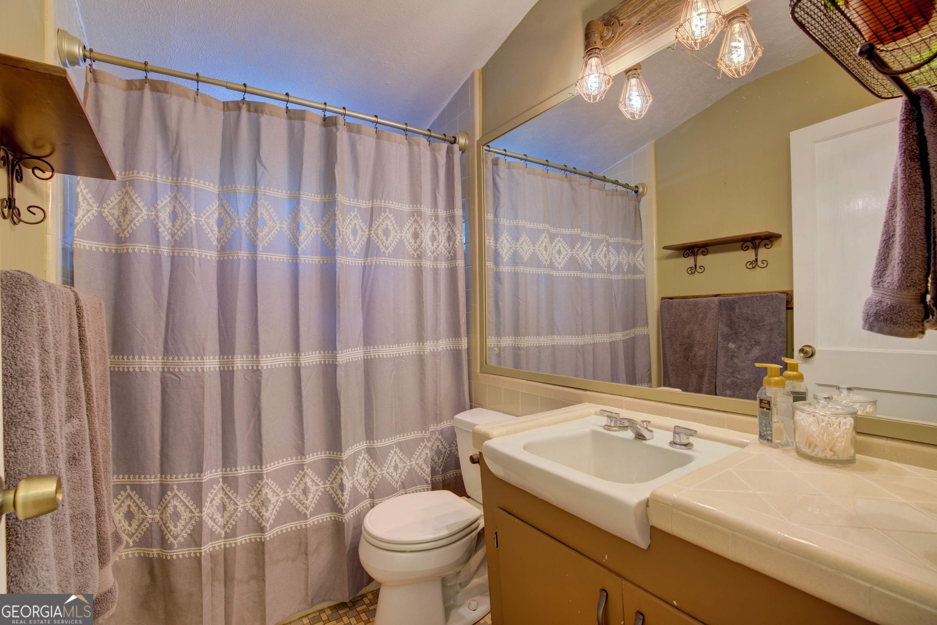 521 West John Hand Road Cedartown, GA 30125 - Photo 33 of 43 a bathroom with a sink toilet and shower