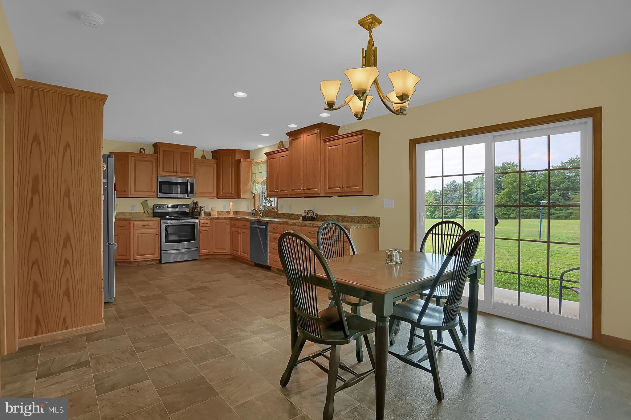 8986 Roxbury Road Orrstown, PA 17244 - Photo 11 of 44 Dining room leads out to back covered porch