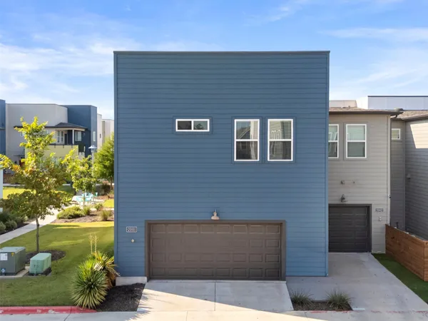 a aerial view of a house with backyard