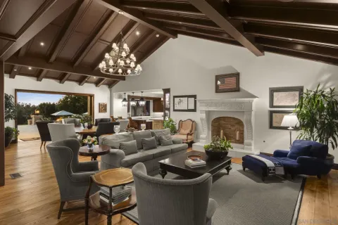 a dining room with furniture window and wooden floor