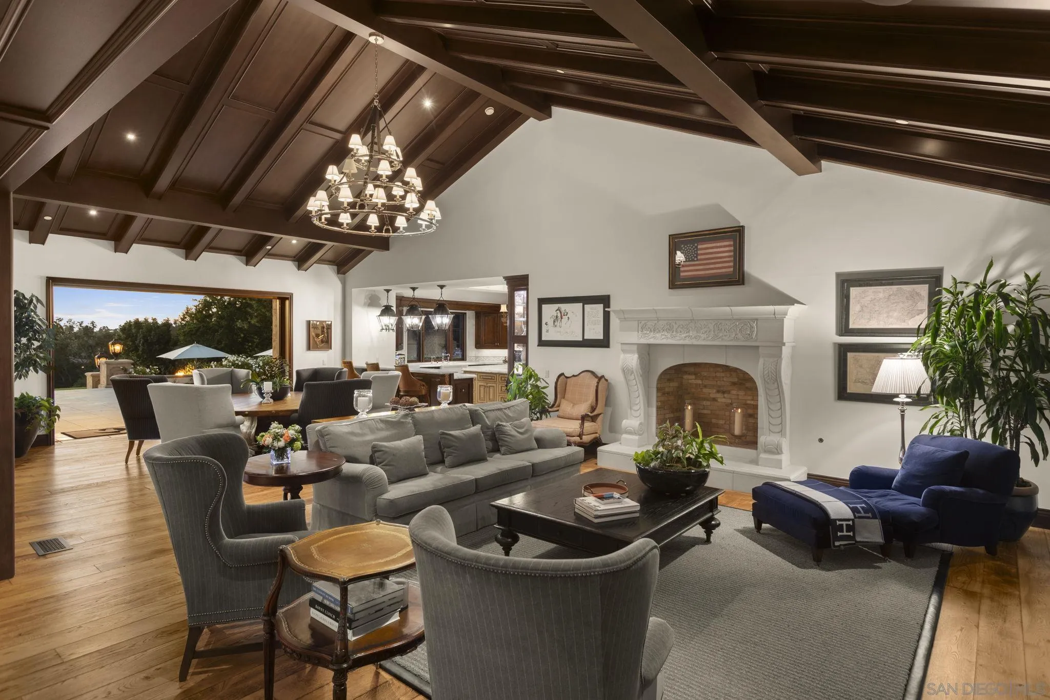 17872 Via De Fortuna Rancho Santa Fe, CA 92067 - Photo 14 of 53 a living room with furniture a fireplace and a chandelier