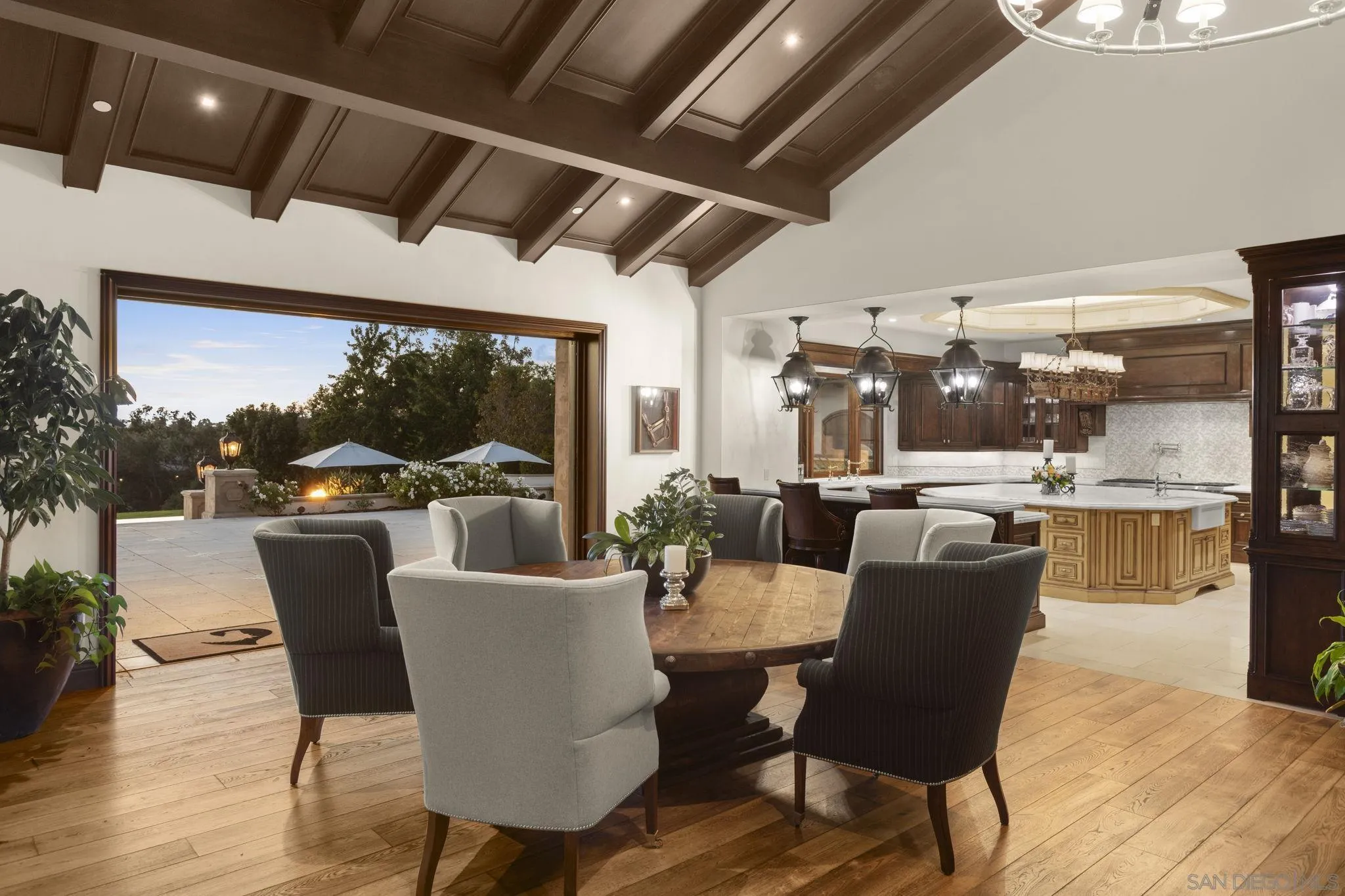 17872 Via De Fortuna Rancho Santa Fe, CA 92067 - Photo 15 of 53 a dining room with furniture window and wooden floor