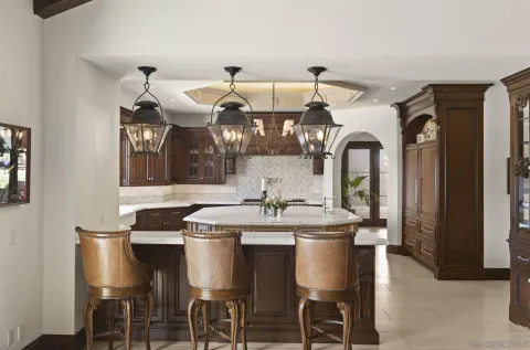 a living room with patio furniture and a fireplace