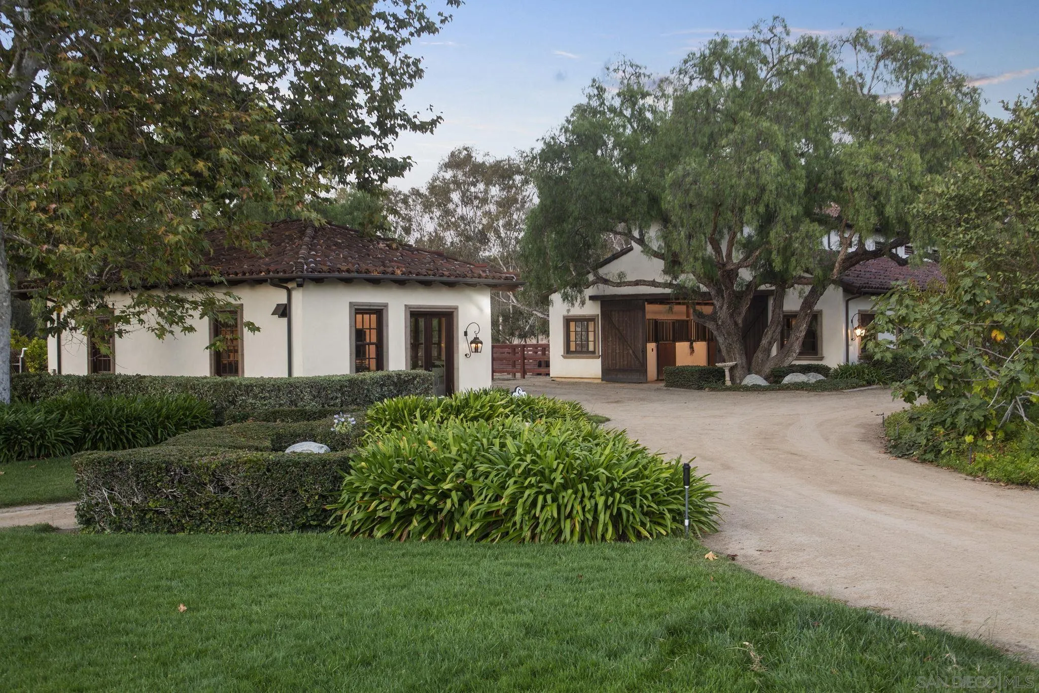 17872 Via De Fortuna Rancho Santa Fe, CA 92067 - Photo 37 of 53 a front view of a house with a garden