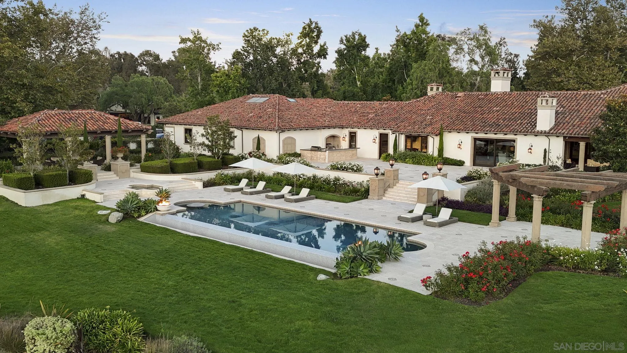 17872 Via De Fortuna Rancho Santa Fe, CA 92067 - Photo 4 of 53 a front view of a house with garden