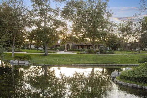 an aerial view of a house with a yard and garage