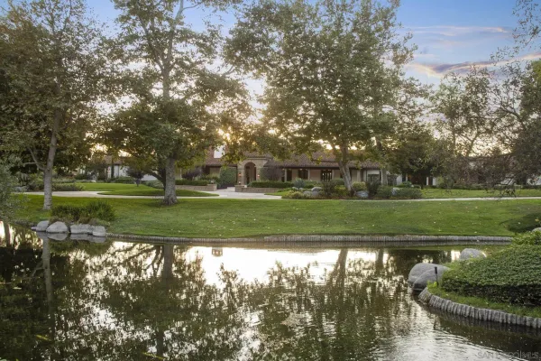 an aerial view of a house with a yard and garage
