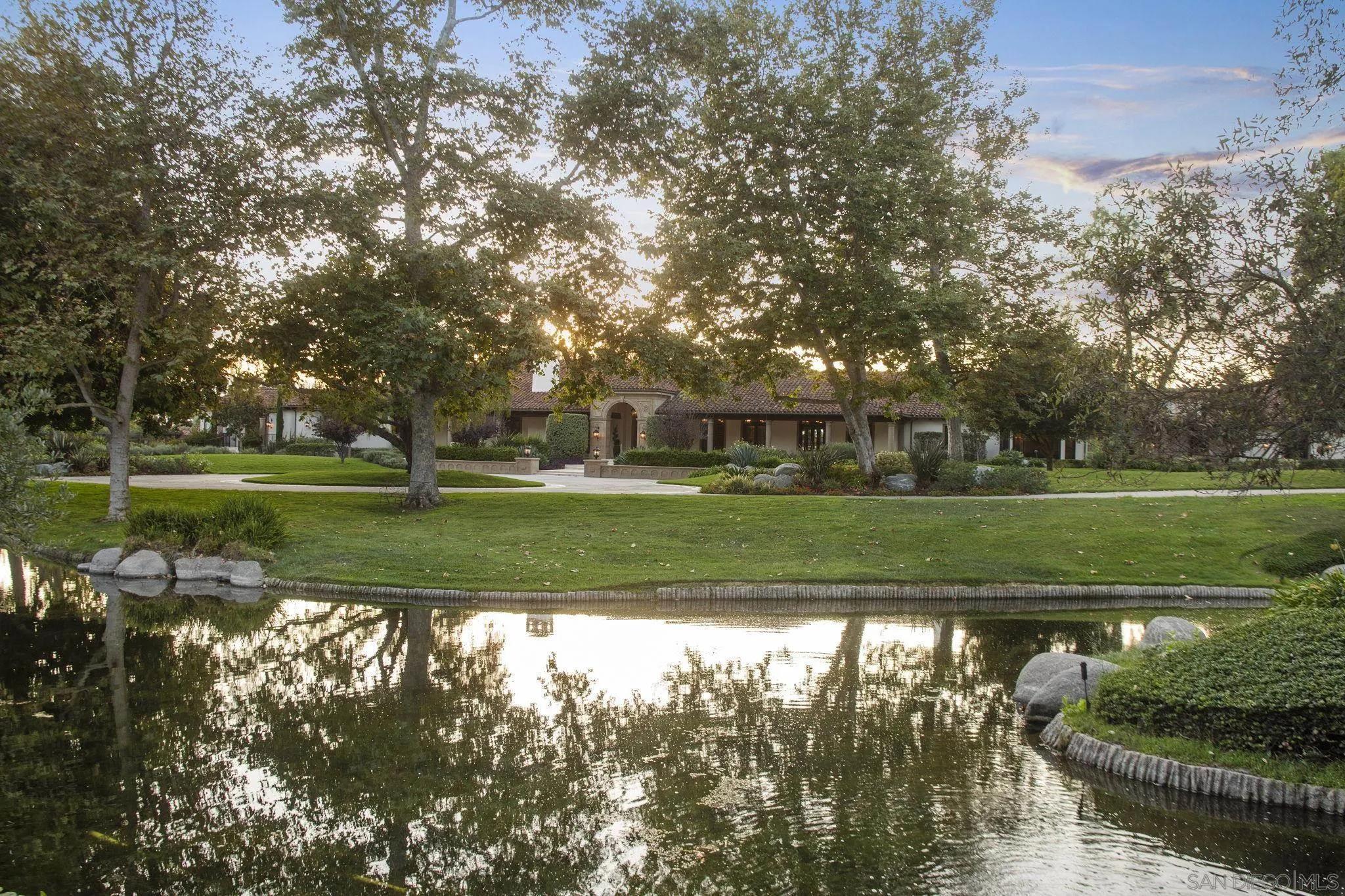 17872 Via De Fortuna Rancho Santa Fe, CA 92067 - Photo 7 of 53 a view of a golf course with a lake
