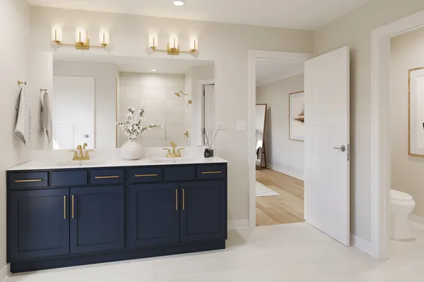 a bathroom with a sink vanity granite and a mirror