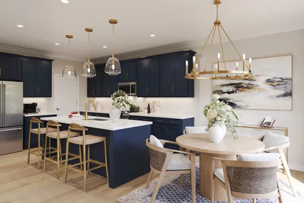 a kitchen with a dining table chairs sink and stove