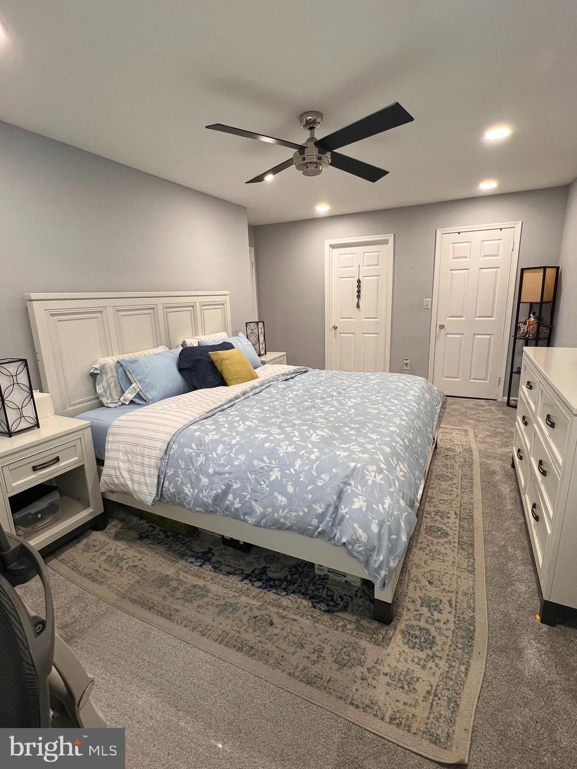 23 Powell Court Hightstown, NJ 08520 - Photo 15 of 31 a bedroom with a bed and a tv on dresser