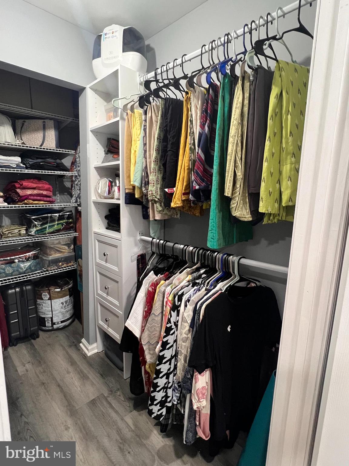 23 Powell Court Hightstown, NJ 08520 - Photo 18 of 31 a view of walk in closet with clothes and shoes