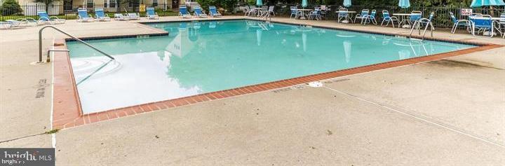 23 Powell Court Hightstown, NJ 08520 - Photo 26 of 31 a view of a swimming pool with outdoor seating