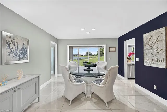 a dining room with furniture and window