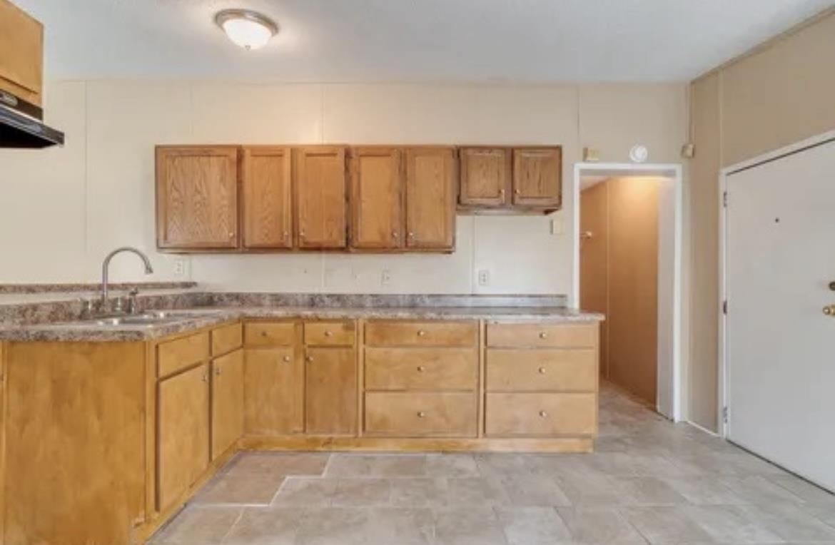 2956 Lake Park Road Memphis, TN 38127 - Photo 2 of 4 a bathroom with a granite countertop sink and a mirror