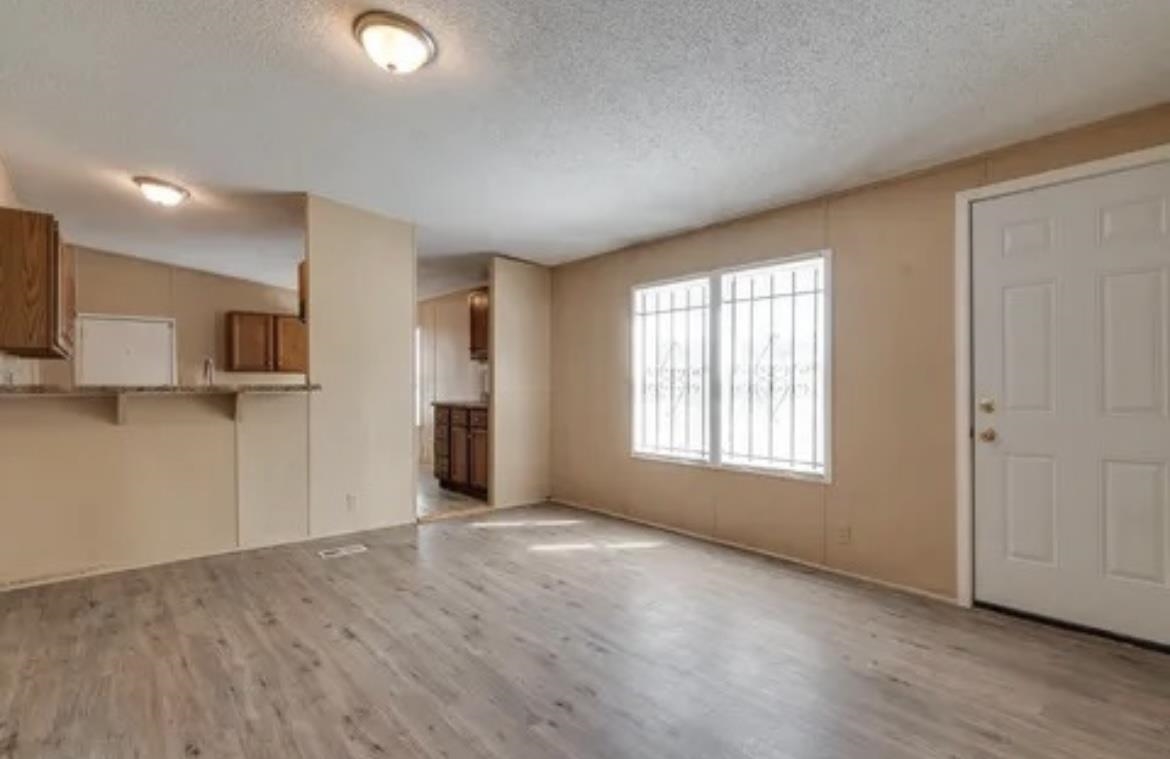 2956 Lake Park Road Memphis, TN 38127 - Photo 3 of 4 a view of empty room with wooden floor and fan