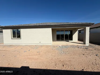 a view of house with backyard space