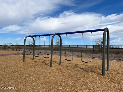 a view of a swimming pool with a lounge chair