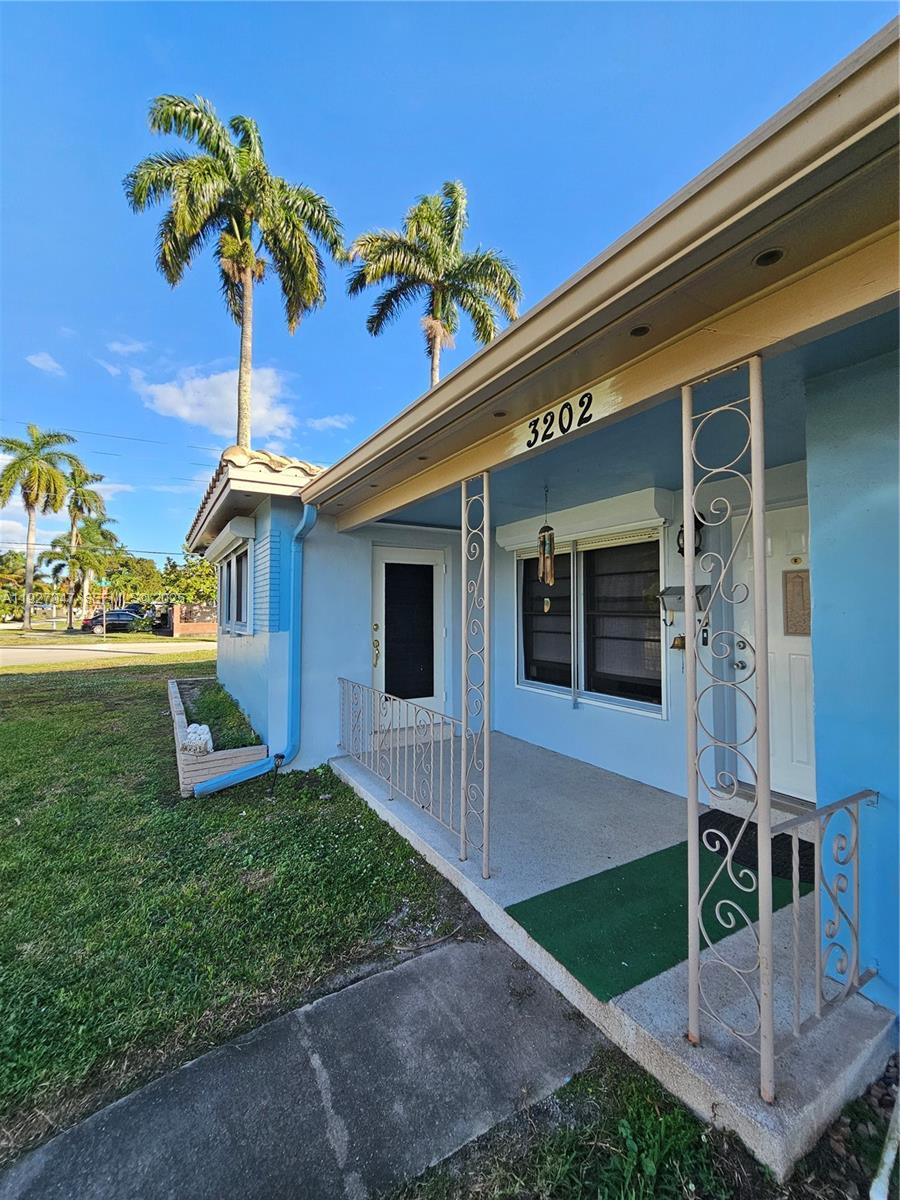 3202 Pierce Street, Unit 3202 Hollywood, FL 33021 - Photo 2 of 12 a front view of a house with garden
