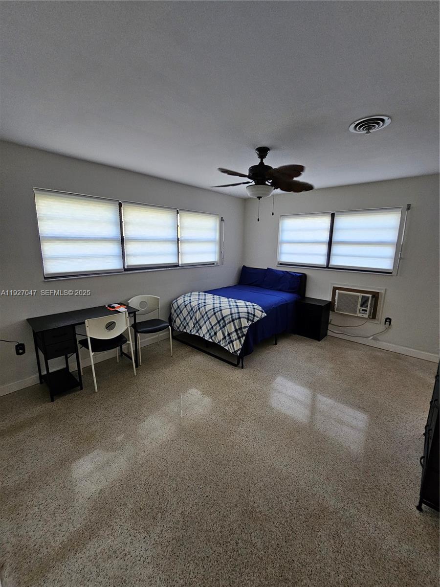 3202 Pierce Street, Unit 3202 Hollywood, FL 33021 - Photo 5 of 12 a bedroom with furniture and a window