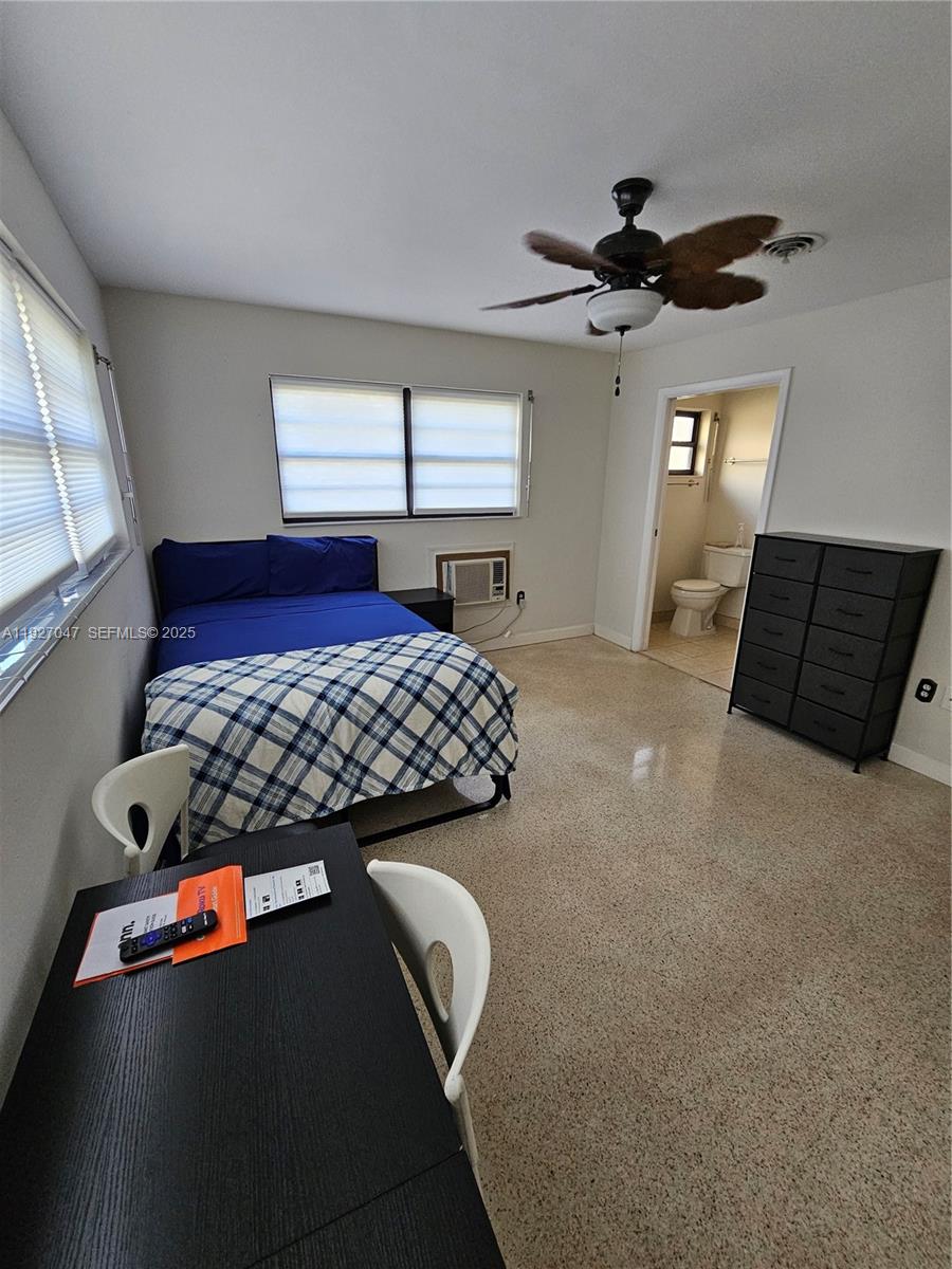 3202 Pierce Street, Unit 3202 Hollywood, FL 33021 - Photo 6 of 12 a bedroom with a bed and window