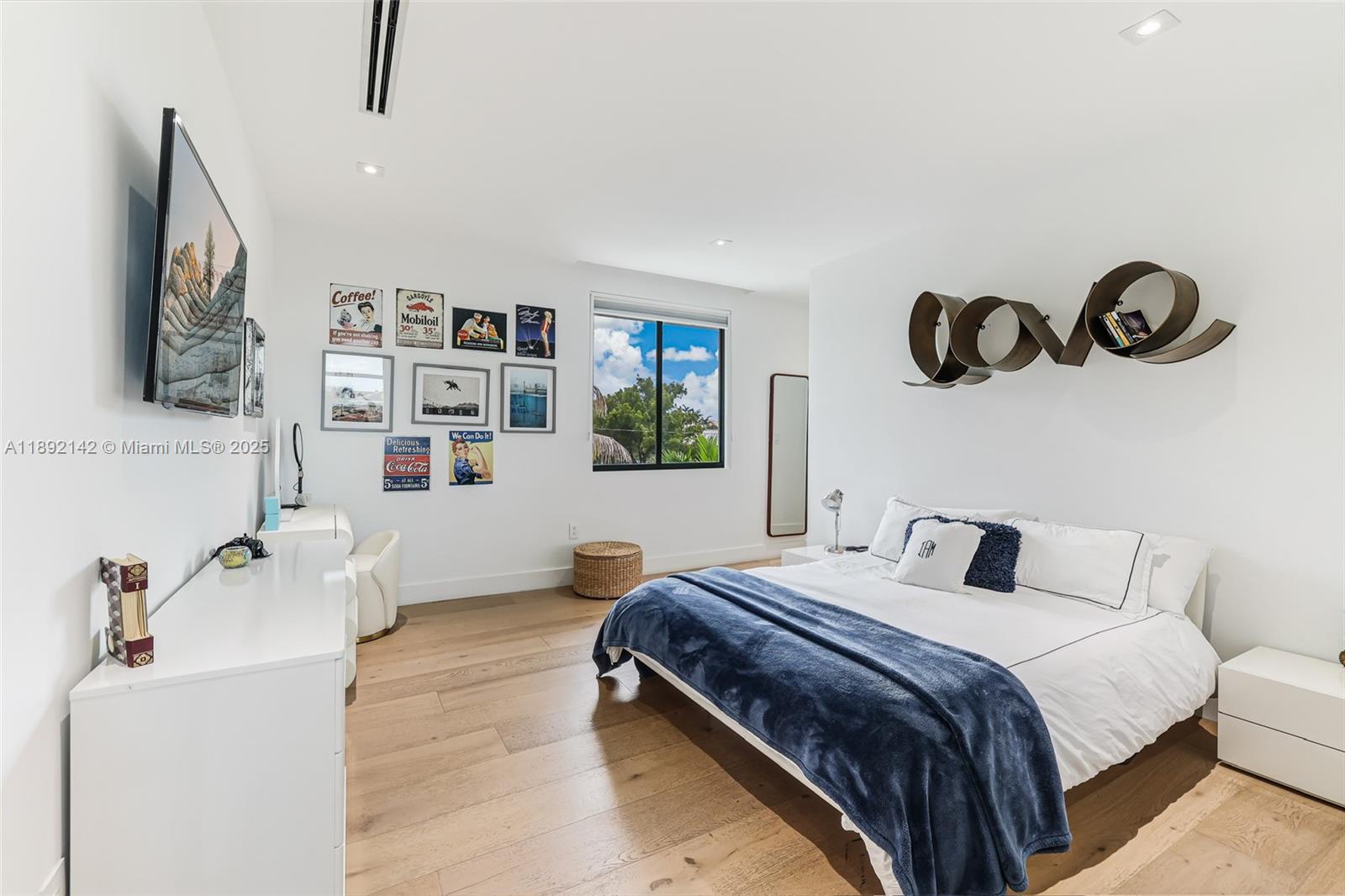 445 Ridgewood Road Key Biscayne, FL 33149 - Photo 20 of 35 a bedroom with a bed and dresser