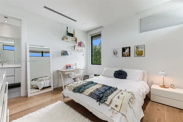 a bedroom with a bed and a couch