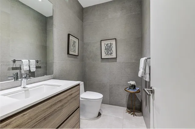 a bathroom with a sink toilet and vanity