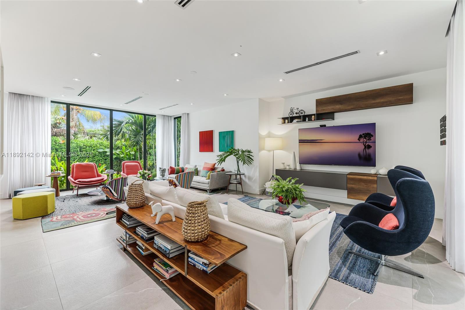 445 Ridgewood Road Key Biscayne, FL 33149 - Photo 5 of 35 a living room with furniture and a flat screen tv