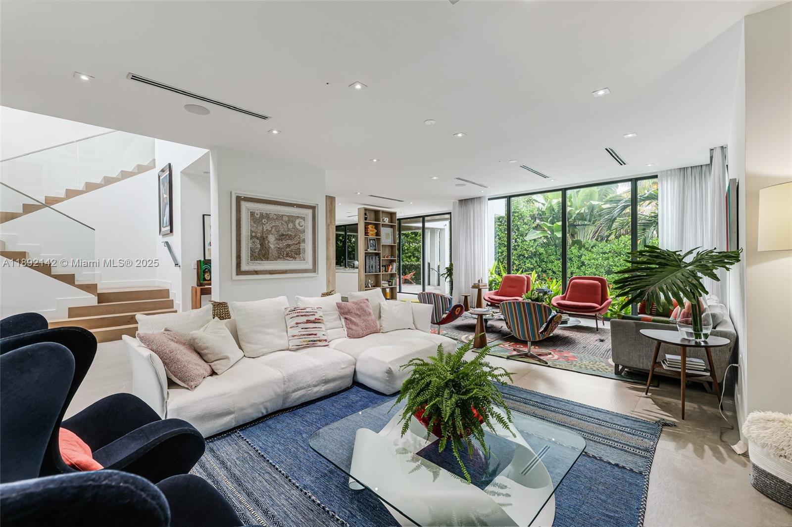 445 Ridgewood Road Key Biscayne, FL 33149 - Photo 7 of 35 a living room with furniture and a large window