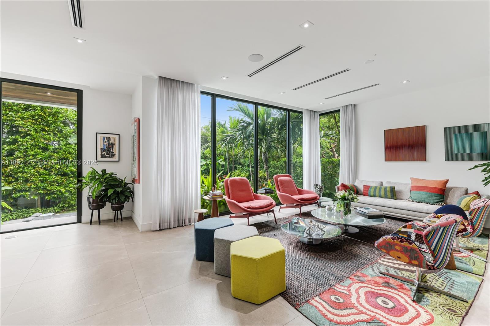 445 Ridgewood Road Key Biscayne, FL 33149 - Photo 8 of 35 a living room with furniture and a floor to ceiling window