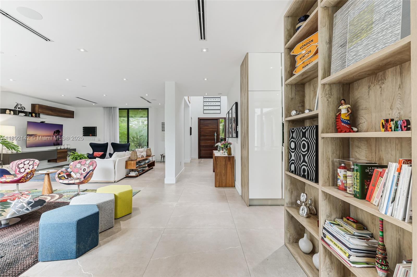 445 Ridgewood Road Key Biscayne, FL 33149 - Photo 9 of 35 a view of a livingroom with furniture and a flat screen tv