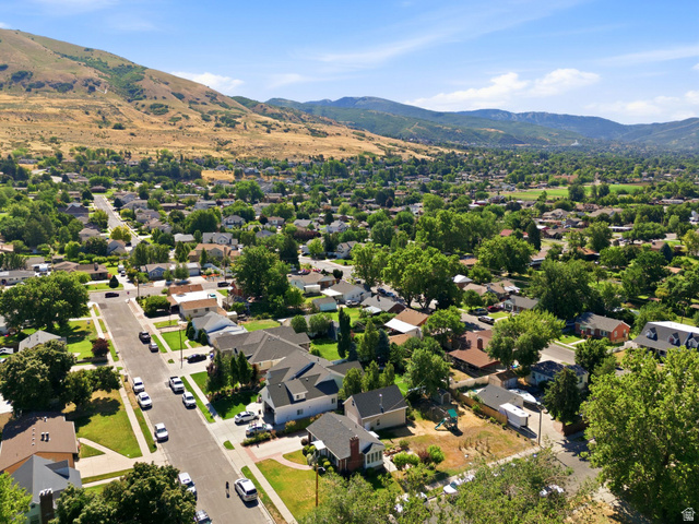 310 East 600 South Centerville, UT 84014 - Photo 39 of 41 Expansive aerial perspective showcasing a residential community with mature trees and mountain backdrops