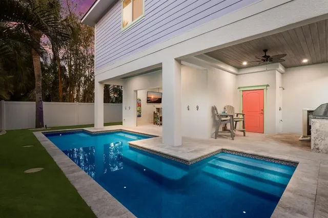 a view of a dining room with furniture a rug and wooden floor