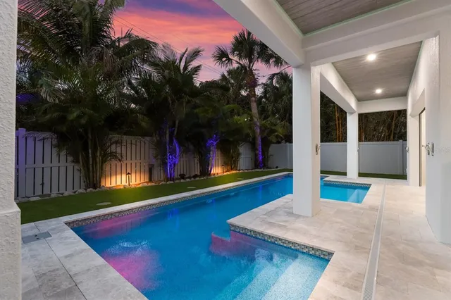 a living room with furniture and a view of kitchen