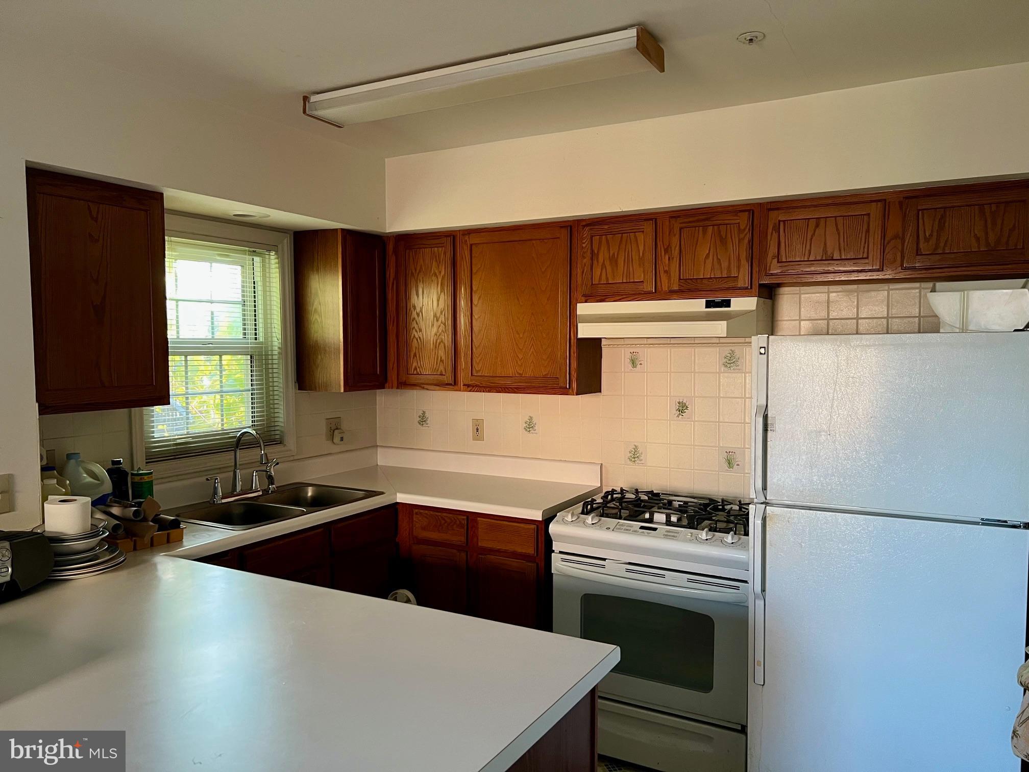 2803 Knox Street Southeast Washington, DC 20020 - Photo 5 of 14 a kitchen with a sink a stove and refrigerator
