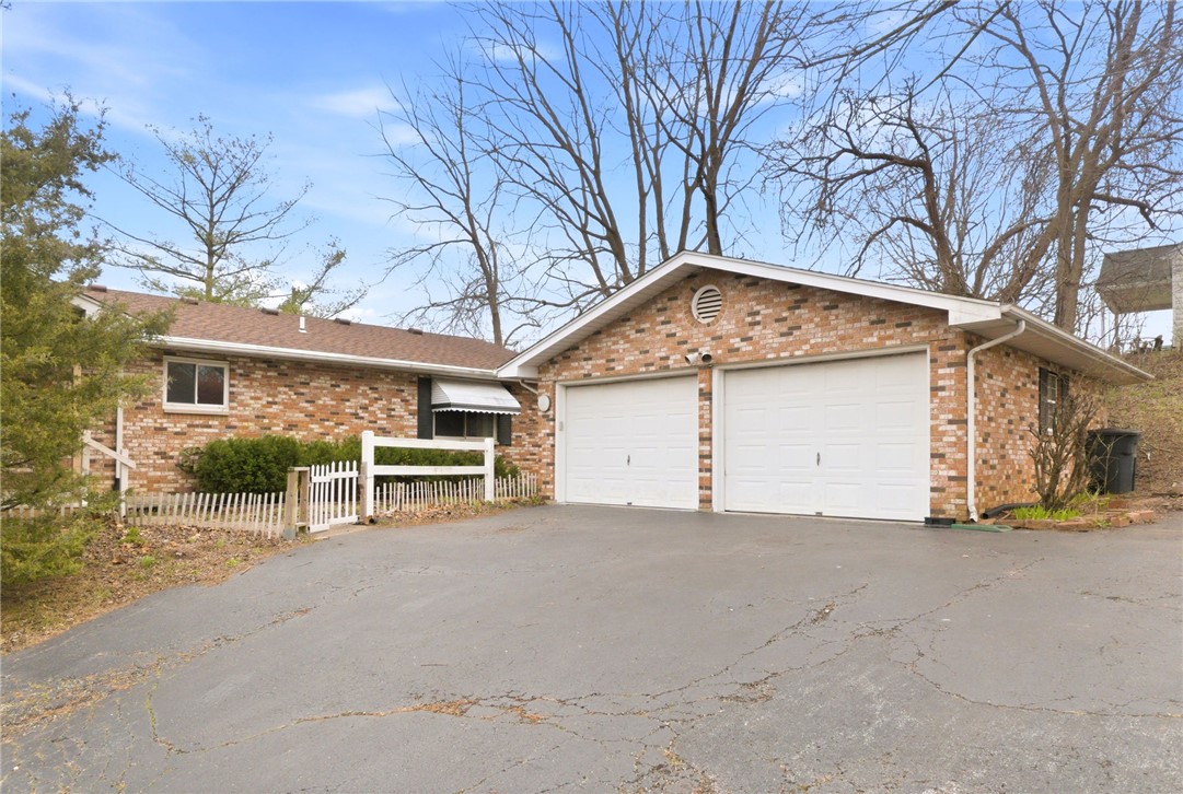 6711 Hamilton-Middletown Road Franklin, OH 45005 - Photo 29 of 49 This residence features a brick exterior and an attached garage with ample parking space.