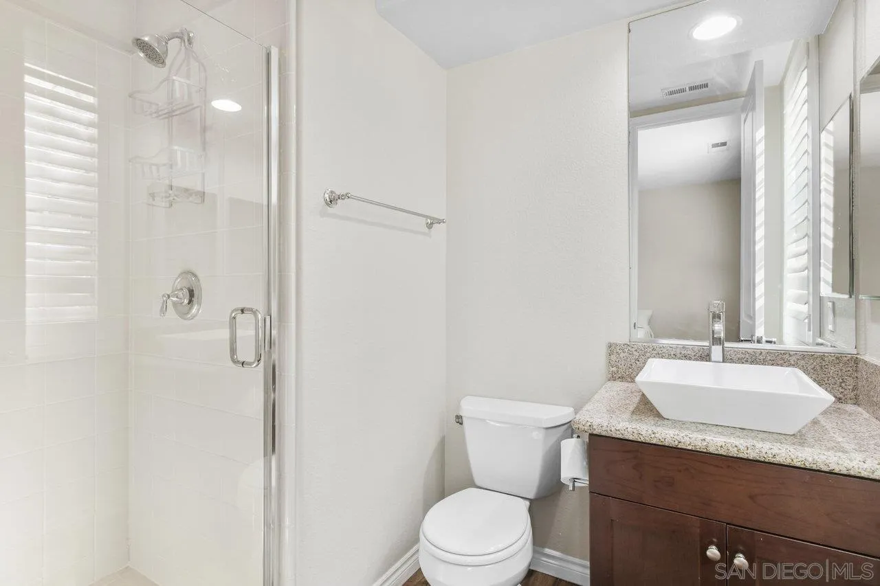 2957 Ranch Gate Road Chula Vista, CA 91914 - Photo 21 of 72 a bathroom with a granite countertop sink toilet and shower