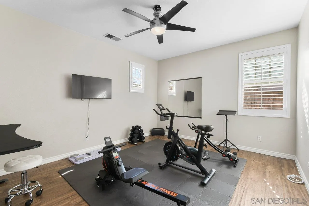 2957 Ranch Gate Road Chula Vista, CA 91914 - Photo 33 of 72 a room with gym equipment and windows
