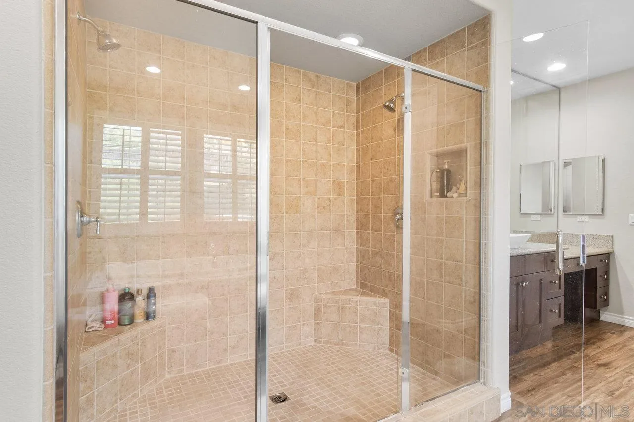 2957 Ranch Gate Road Chula Vista, CA 91914 - Photo 41 of 72 a bathroom with a glass shower door