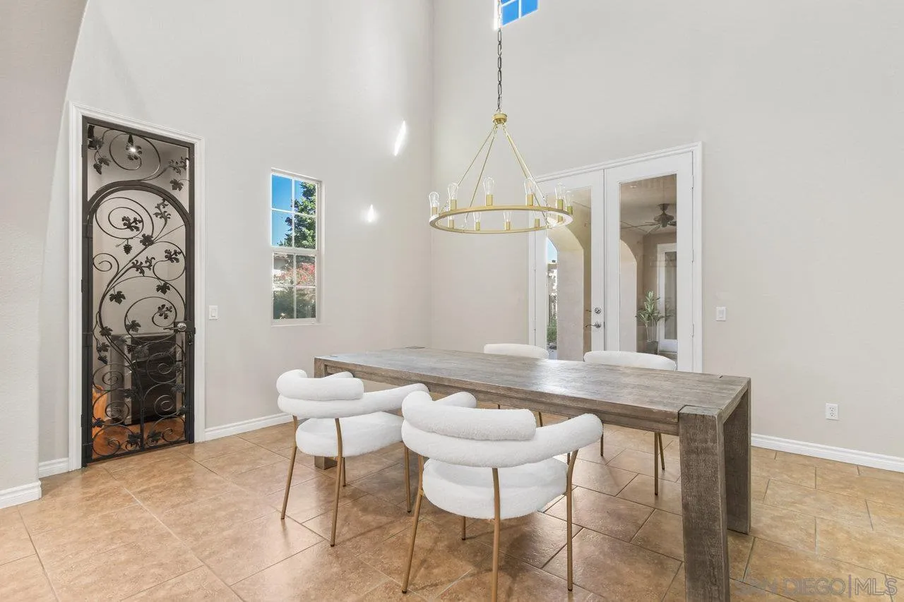 2957 Ranch Gate Road Chula Vista, CA 91914 - Photo 8 of 72 a view of a dining room with furniture and chandelier