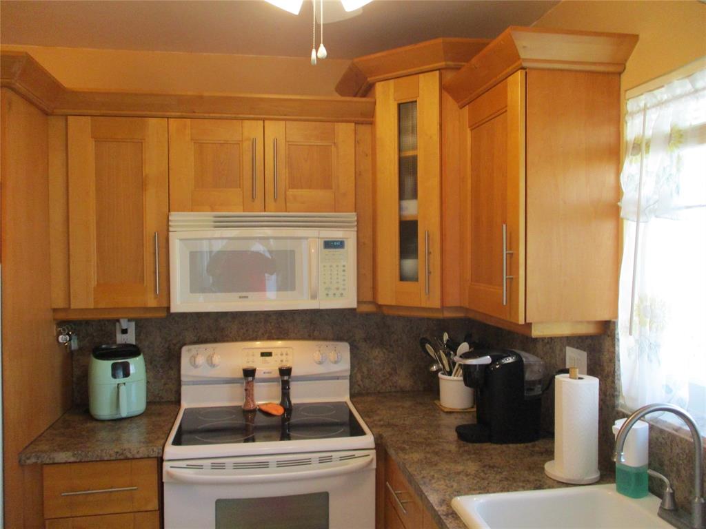 2100 Northeast 38th Street, Unit 217 Lighthouse Point, FL 33064 - Photo 6 of 28 Kitchen looking in from the Lanai.