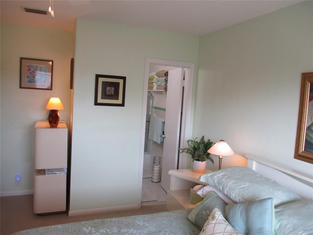 2100 Northeast 38th Street, Unit 217 Lighthouse Point, FL 33064 - Photo 7 of 28 Main Bedroom and en suite