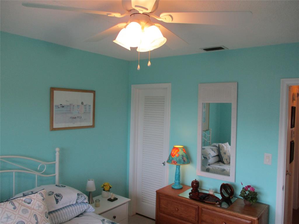 2100 Northeast 38th Street, Unit 217 Lighthouse Point, FL 33064 - Photo 10 of 28 2nd Bedroom with a Key West Flair!