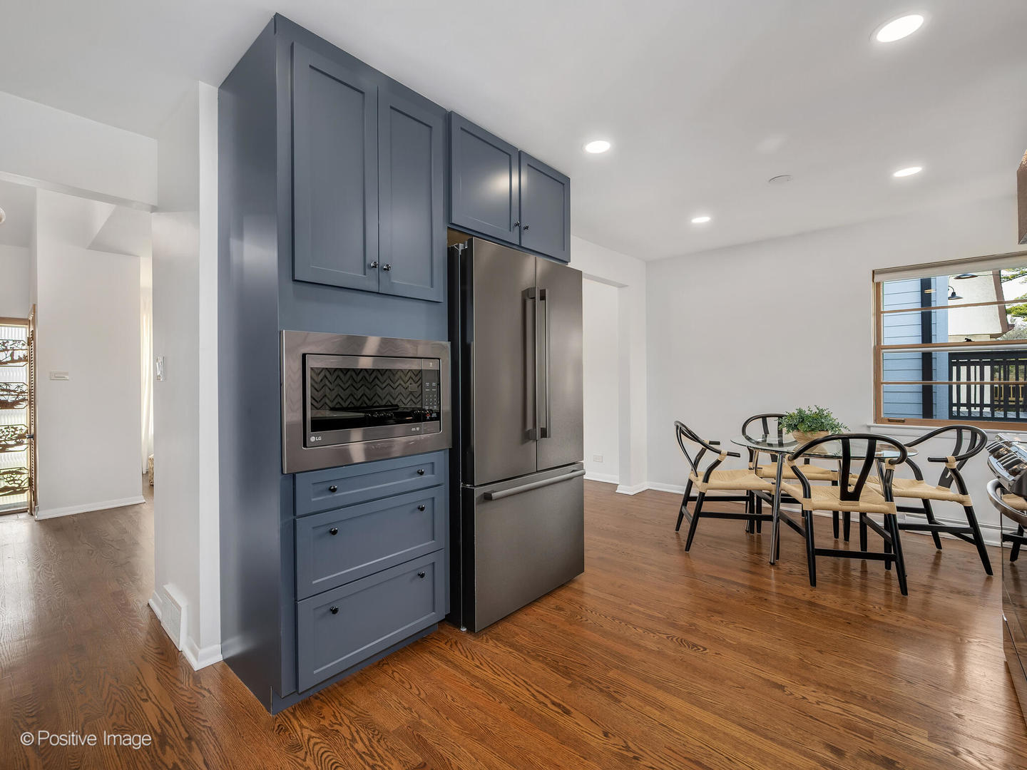 284 Blackhawk Road Riverside, IL 60546 - Photo 11 of 36 a kitchen with granite countertop a refrigerator cabinets and wooden floor