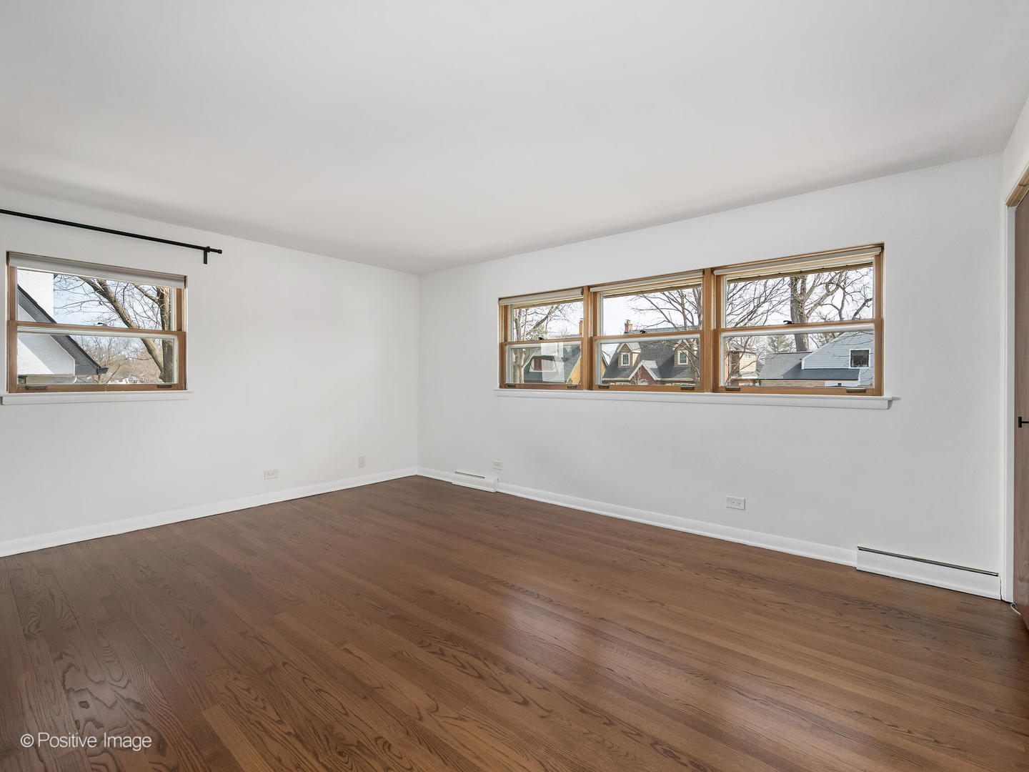 284 Blackhawk Road Riverside, IL 60546 - Photo 17 of 36 a view of empty room with wooden floor and fan