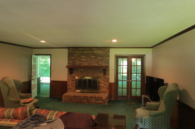 382 Stone Edge Road Macon, GA 31210 - Photo 3 of 22 a living room with furniture and a fireplace