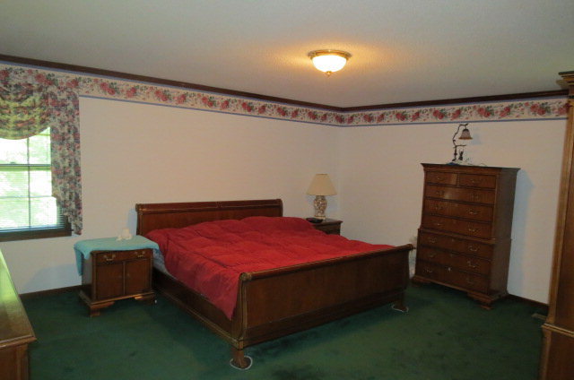 382 Stone Edge Road Macon, GA 31210 - Photo 8 of 22 a bedroom with a bed and a window